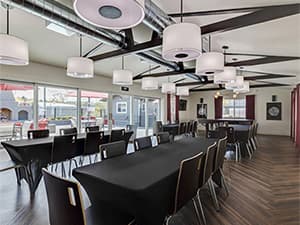 HOA clubhouse interior by Jeff Smith Construction in Granite Bay. Interior of an HOA clubhouse featuring tables, chairs, and event space constructed by Jeff Smith Construction in Granite Bay, CA.