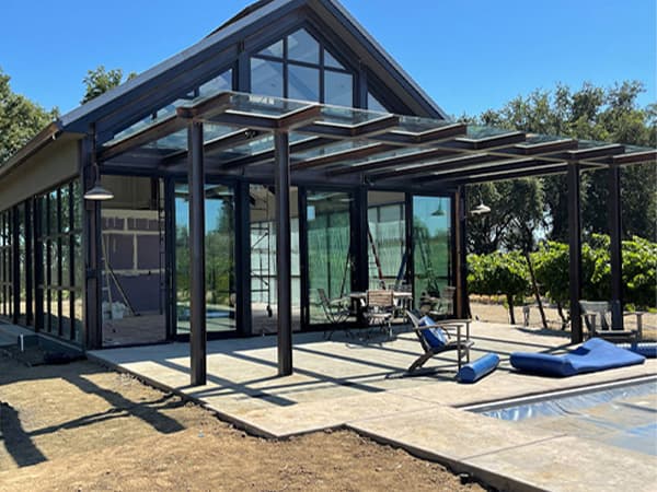 HOA clubhouse exterior by Jeff Smith Construction in El Dorado Hills. Completed exterior of an HOA community clubhouse with poolside access, built by Jeff Smith Construction in El Dorado Hills, CA.
