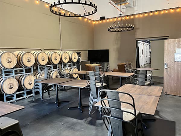 Wine barrel tasting room design by Jeff Smith Construction in Rescue. Restaurant-style tasting room with wine barrels and seating designed by Jeff Smith Construction in Rescue, CA.