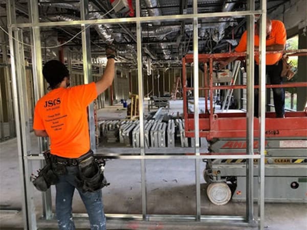 Warehouse steel framing project in Rancho Cordova. Jeff Smith Construction crew setting up a steel frame structure inside a warehouse during a commercial build in Rancho Cordova, CA.