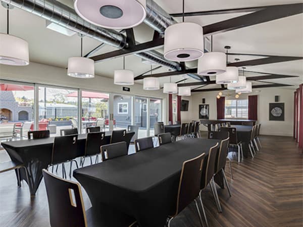 HOA clubhouse interior by Jeff Smith Construction in Granite Bay. Interior of an HOA clubhouse featuring tables, chairs, and event space constructed by Jeff Smith Construction in Granite Bay, CA.